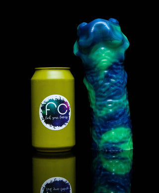 A Axa the Singularity Stroker by Fantasticocks next to a can with a blue and green color.