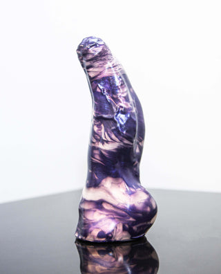 A smaller size purple marbled Keith the Yeti dildo from Fantastic Kreations sitting on a table.