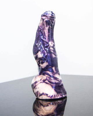 A smaller-sized, purple and black marbled Keith the Yeti dildo with girth changes on a black surface made by Fantastic Kreations.