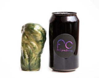 We use a soda can to compare sizes for all of our sex toys, shown here is Marri the Dragon, a toy designed for transgender or genderqueer individuals 