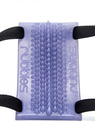 A Rubbies PEAK purple plastic pad for external stimulation with a black strap attached. (Brand Name: Fantasticocks)