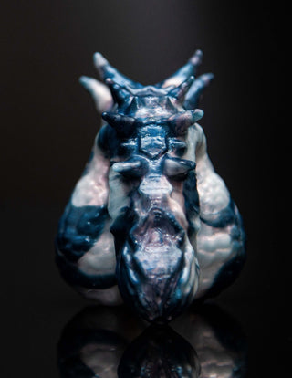 A blue and white Dracul the Trans Male Packer figurine from Fantasticocks.